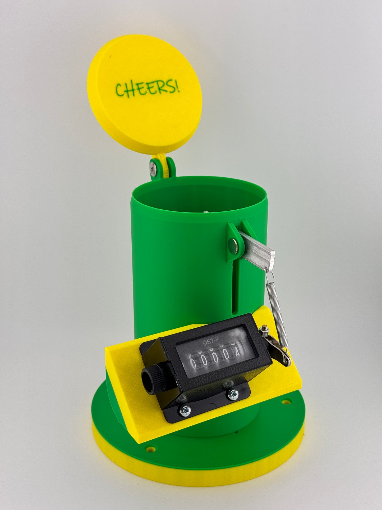 A John Deere themed beer can counter with a green base, yellow top, and a digital count display.